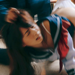 Female school students beating Yuka Osawa